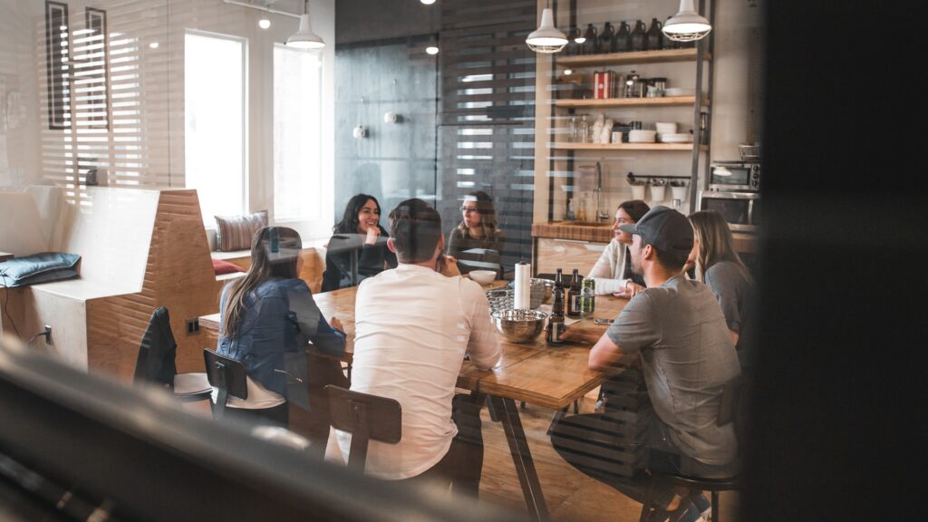 a social media team in a collaborative meeting outside the office