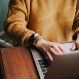 a social media marketing manager working on a laptop