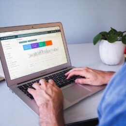 a digital marketer checking the organic SEO stats of his website on a macbook air