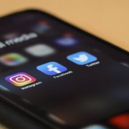 a mobile phone showing different social media platforms