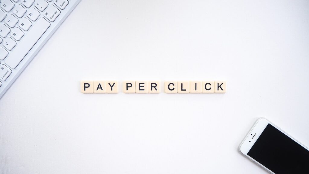scrabble tiles laid out on a table spelling pay-per-click
