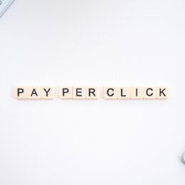 scrabble tiles laid out on a table spelling pay-per-click